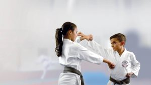 GKR Karate Self defence, boy punching, girl blocking