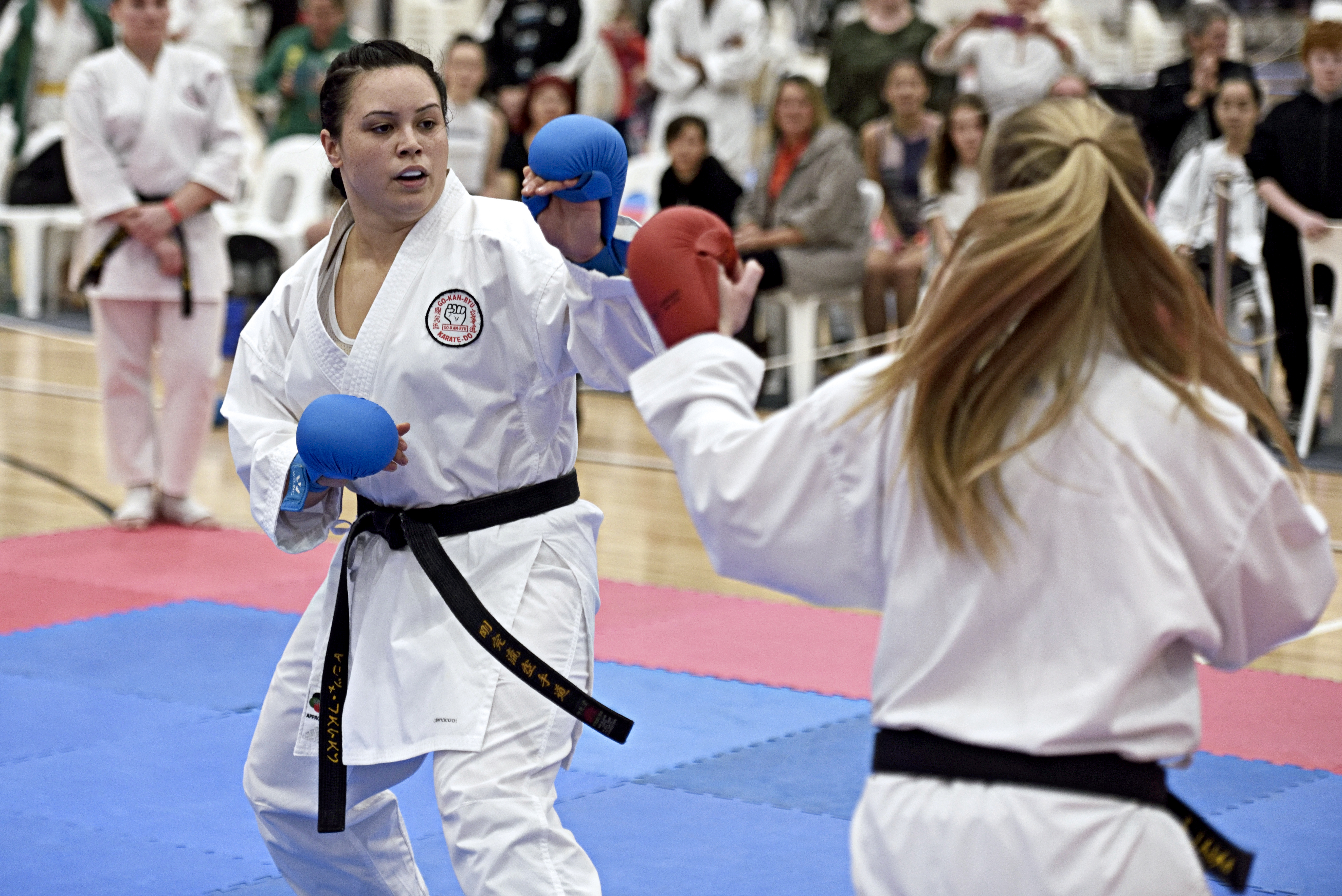 two young women perform karate, wearing gkr karate gi 