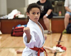 small girl performing a karate move