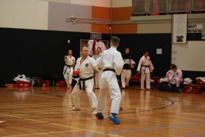 two karate students fighting together