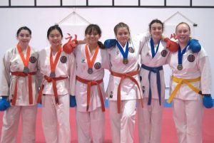 gkr karate students wearing medals